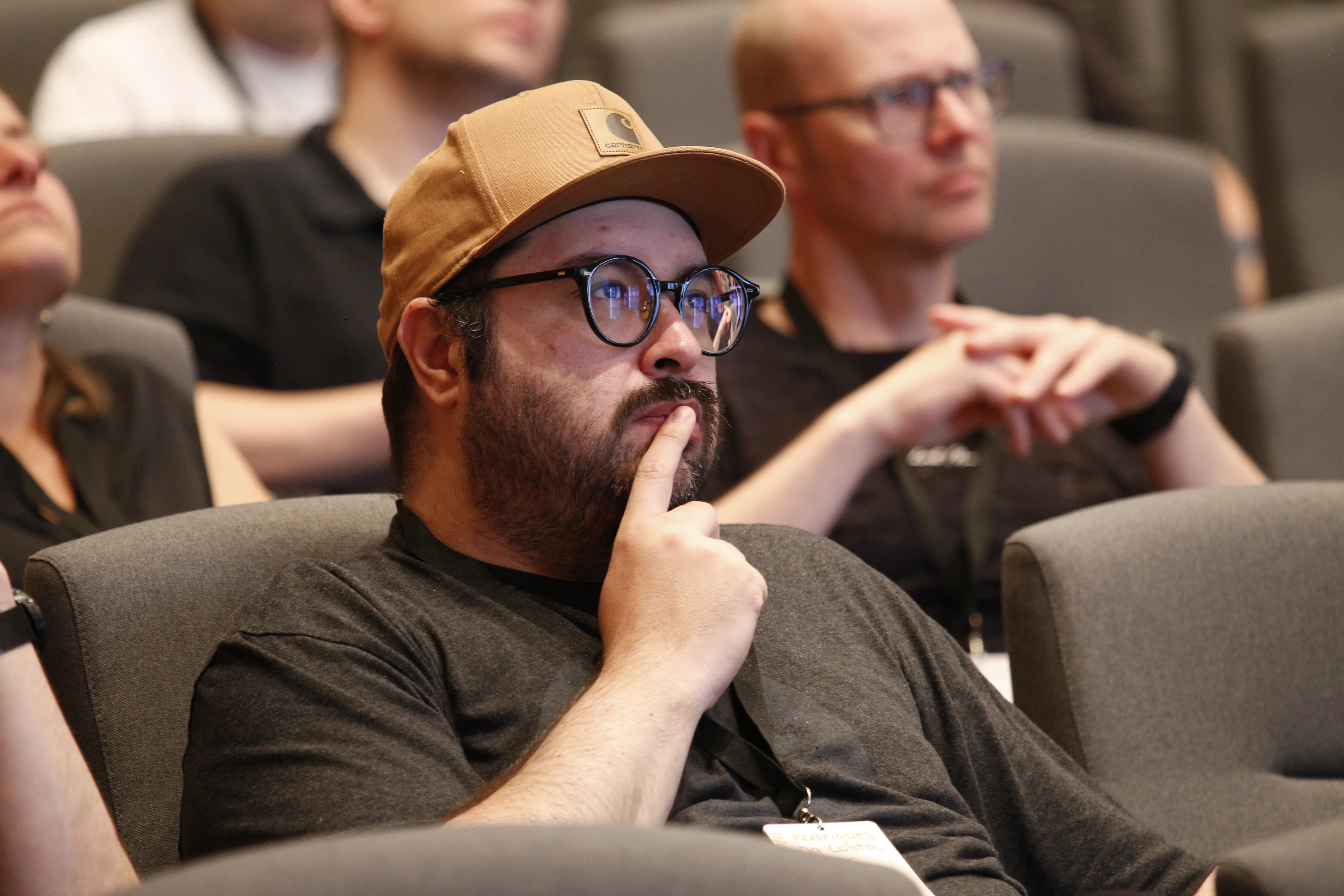 Daniel Filho wearing a brown hat, focused during UI5 Conf 2023